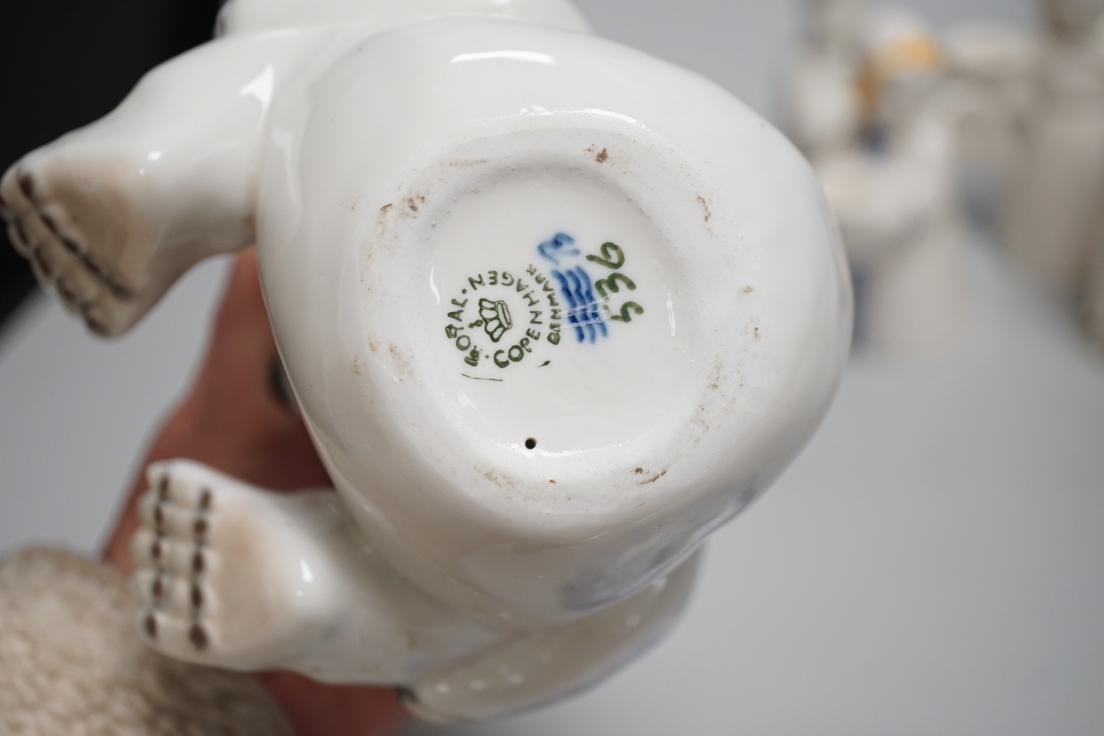 A group of Royal Copenhagen porcelain figural candle holders, a vase, the figure of a polar bear cub and a Mother’s Day dish
